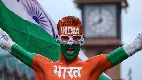 An activist of Akhil Bharatiya Vidyarthi Parishad (ABVP), a student organization of Rashtriya Swayamsevak Sangh (RSS), is waving India's national flag to mark India's Independence Day, in Srinagar, Jammu and Kashmir, on August 15, 2024.