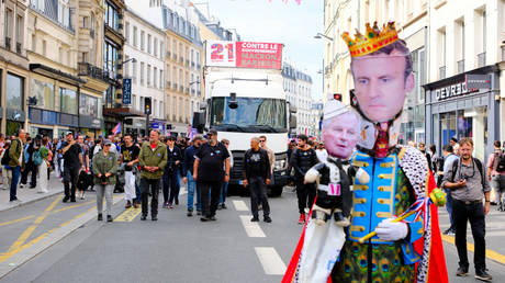 Michel Barnier and Emmanuel Macron caricatures at a protest against the new government, Paris, France, September 21, 2024.