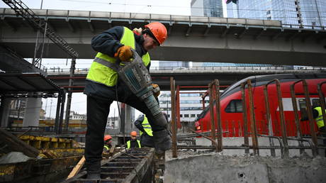 FILE PHOTO: A worker is seen at the construction site of the Moskva-City railway station.