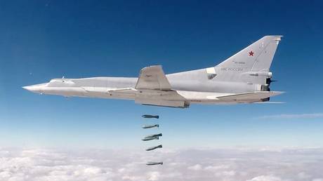 FILE PHOTO: A Russian Tu-22M3 bomber drops munitions on militants in Syria in 2017.