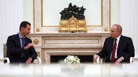 FILE PHOTO: Syrian President Bashar al-Assad and Russian President Vladimir Putin.