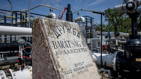 FILE PHOTO: A stone commemorates the Druzhba 2 crude oil pipeline at an oil refinery in Hungary.