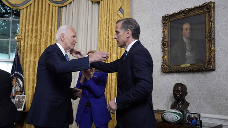 FILE PHOTO: US President Joe Biden hugs son Hunter Biden after addressing the nation from the Oval Office of the White House on July 24, 2024 in Washington, DC.