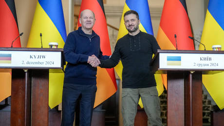 Olaf Scholz and Vladimir Zelensky shake hands at the press conference on December 2, 2024, Kiev, Ukraine.