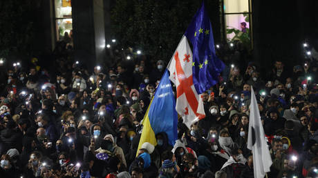 File photo: Protesters wave Georgian, Ukrainian, and EU flags in Tbilisi, Georgia, November 29, 2024.