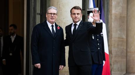 FILE PHOTO: French President Emmanuel Macron (R) welcomes British Prime-Minister Keir Starmer (L) at the Elysée Palace.