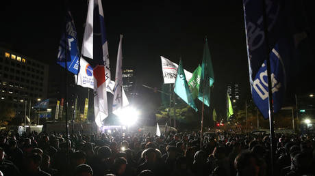 People gather in front of the National Assembly in Seoul, South Korea, on December 3, 2024