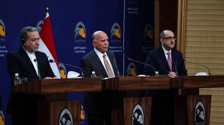 Left to right: Iranian Foreign Minister Abbas Araghchi, Iraqi Foreign Minister Fuad Hussein and Syrian Foreign Minister Bassam Sabbagh meet in Baghdad, December 6, 2024.