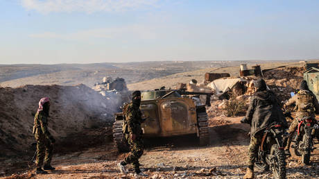 Hayat Tahrir al-Sham fighters operate in Aleppo province, Syria, November 27, 2024.