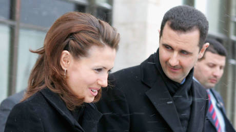 FILE PHOTO: Syrian President Bashar Assad and his wife Asma during a visit to Moscow State Institute of International Relations, January 25, 2005.