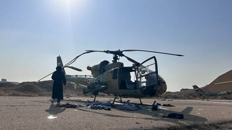 Military vehicles and helicopters damaged as a result of the Israeli attack on the  Mezzeh Air Base in Syrian capital, Damascus.