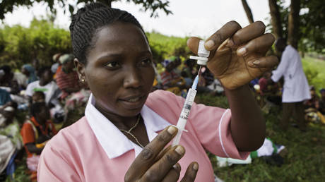 FILE PHOTO: A Ugandan medic prepares to make an injection.