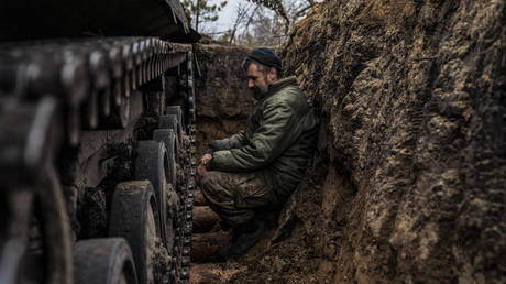 FILE PHOTO: Ukrainian tank men prepare BWP infantry fighting vehicle for combat.