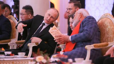 President of Russia Vladimir Putin and Prime Minister of India Narendra Modi, right, during a concert ahead of an informal lunch for the heads of BRICS delegations held as part of the 16th BRICS summit in Kazan.