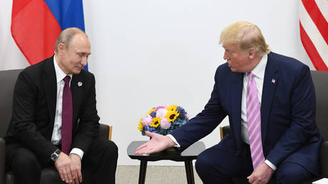 FILE PHOTO: Russian President Vladimir Putin and US President Donald Trump meet at the G20 summit in Osaka, Japan, June 28, 2019