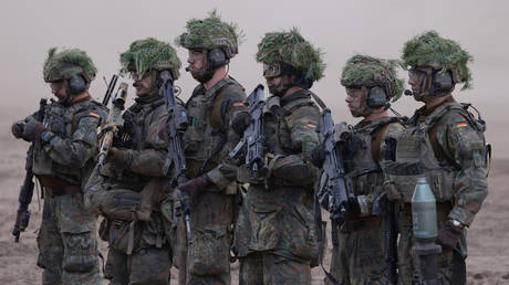 FILE PHOTO. Troops of the Bundeswehr, the German armed forces, stand with their weapons at the Quadriga military exercises involving German, French, Lithuanian and Dutch troops during a Distinguished Visitors' Day near Pabrade, Lithuania.