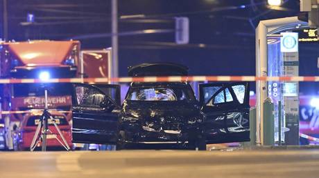 A damaged car sits with its doors open after a driver plowed into a busy Christmas market in Magdeburg, Germany, Decemeber 21, 2024