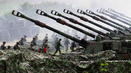 FILE PHOTO. Taiwanese soldiers are deployed to a live-ammunition artillery training featuring M109 American self-propelled howitzers, at a coastal area in Taichung, Taiwan.