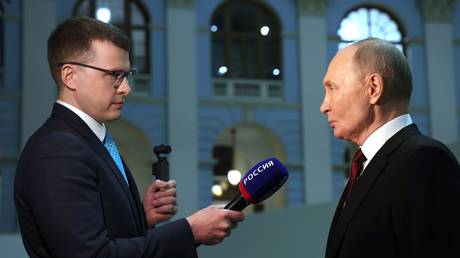 Russian President Vladimir Putin answers questions from journalist Pavel Zarubin.