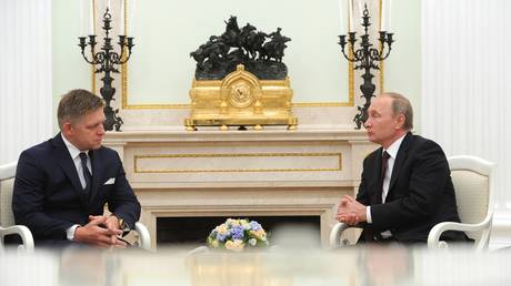 FILE PHOTO: Russian President Vladimir Putin, right, and Slovak Prime Minister Robert Fico during their meeting at the Moscow Kremlin.