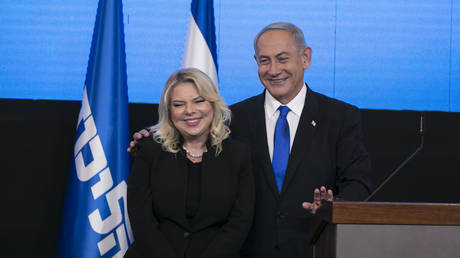 Benjamin Netanyahu and his wife Sara Netanyahu greet supporters at an election-night event on November 1, 2022 in Jerusalem.