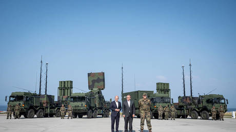 German Chancellor Olaf Scholz and Defense Minister Boris Pistorius pose in front of a German-made IRIS T SLM air defense system on September 4, 2024, in Todendorf, Germany.