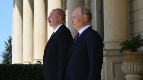 FILE PHOTO. Russian President Vladimir Putin and Azerbaijani President Ilham Aliyev.