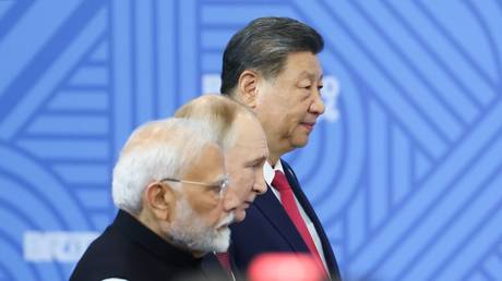 Indian Prime Minister Narendra Modi, Russian President Vladimir Putin and Chinese President Xi Jinping attend a family photo opportunity by heads of the delegations at the 16th BRICS summit in Kazan, Republic of Tatarstan, Russia.