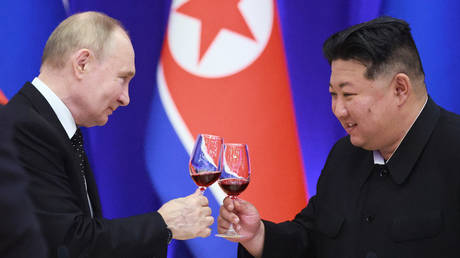 Russian President Vladimir Putin and North Korean leader Kim Jong Un attend a reception at the Mongnangwan Reception House in Pyongyang, North Korea.