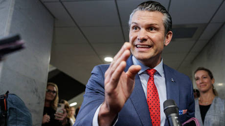 Pete Hegseth speaks to reporters after meeting with lawmakers on Capitol Hill on December 5, 2024 in Washington, DC.