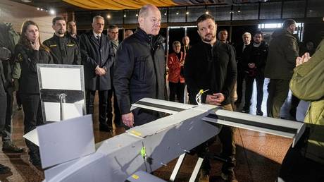 FILE PHOTO: Ukrainian leader Vladimir Zelensky shows drones to German Chancellor Olaf Scholz in Kiev, December 2024.