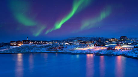 FILE PHOTO: Polar lights over Ilulissat, Greenland