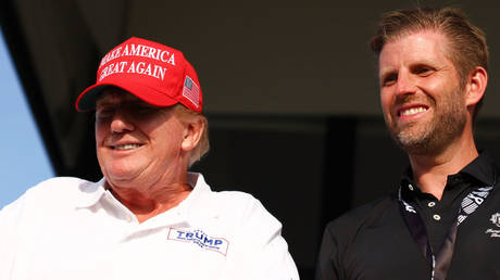 FILE PHOTO: US President-elect Donald Trump and son Eric Trump at the LIV Golf Invitational, Doral, Florida, April 7, 2024.