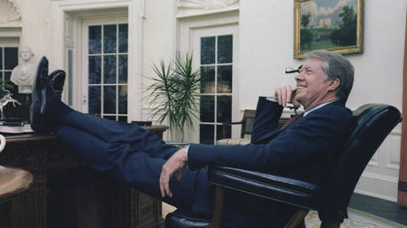 US President Jimmy Carter sitting in the Oval Office in 1978.