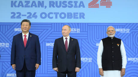 President of Russia Vladimir Putin, President of China Xi Jinping, left, and Prime Minister of India Narendra Modi, right, during a group photo ceremony for the heads of delegation at the 16th BRICS summit in Kazan.