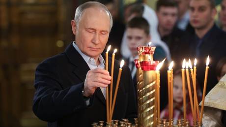 Russian President Vladimir Putin attends a Christmas mass at the Church of Saint George the Victorious in Moscow on January 6, 2025.