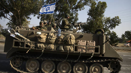 FILE PHOTO: Israeli soldiers in an armored personnel carrier.