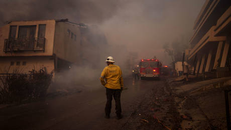 Firefighters battle flames from the Palisades Fire in Malibu, California, January 8, 2025