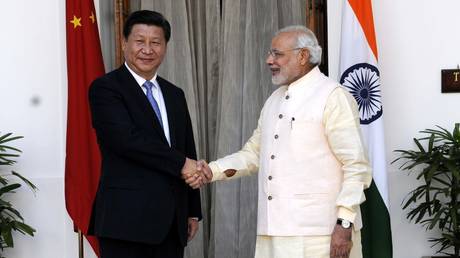 FILE PHOTO: Prime Minister Narendra Modi (R) with Chinese President Xi Jinping (L) during a meeting in New Delhi, India.