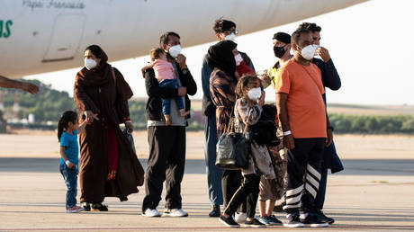 FILE PHOTO:  Afghans evacuated from Kabul at the Torrejon Military Air Base, Madrid, Spain, August 27, 2021.