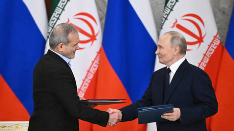 Russian President Vladimir Putin and Iranian President Masoud Pezeshkian attend a ceremony to sign an agreement of comprehensive strategic partnership between two countries at the Kremlin in Moscow, Russia.