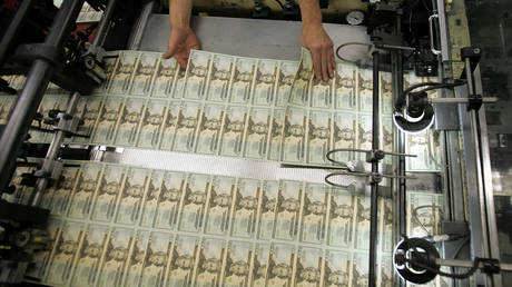 File Photo. Twenty dollar bills being printed at the Department of the Treasury Bureau of Engraving and Printing in Washington, DC, US.