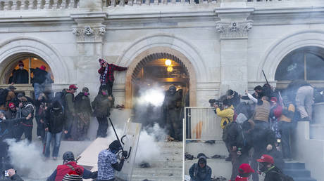 Supporters of Donald Trump clash with police at the Capitol building in Washington, DC on January 6, 2021.