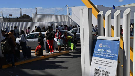 Migrants seeking to get into the US waiting for immigration checks, El Chaparral border crossing port in Tijuana, Mexico, January 17, 2025.