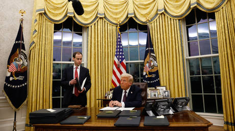 President Donald Trump signs executive orders in the Oval Office on January 20, 2025 in Washington, DC.