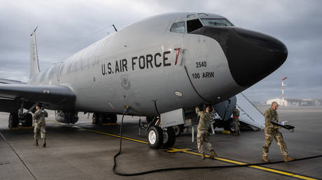 Soldiers prepare a US Air Force KC-135 Stratotanker plane for take-off at Spangdahlem Airbase in Germany.