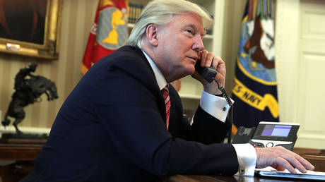 FILE PHOTO. US President Donald Trump speaks on the phone.