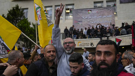 Palestinian prisoners are greeted by a crowd after being released from Israeli prison following a ceasefire agreement with Israel, in the West Bank city of Ramallah, Saturday, January 25, 2025.